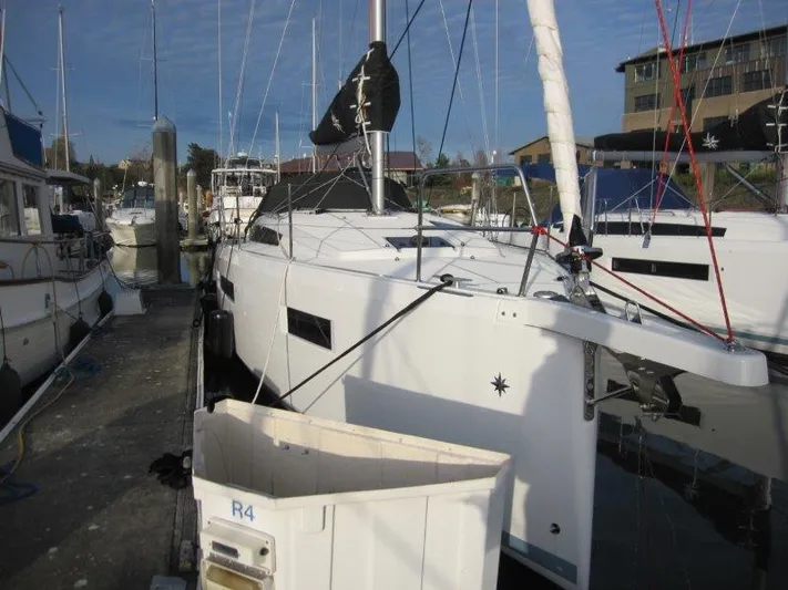  Yacht Photos Pics 2024 Jeanneau Sun Odyssey 410 sailboat docked at marina.