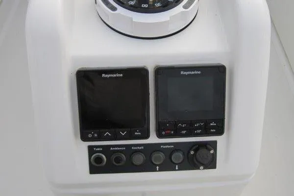 Yacht Photos Pics Control panel of 2024 Jeanneau Sun Odyssey 410 with Raymarine displays and buttons.