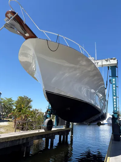  Yacht Photos Pics Buddy Davis 78 yacht from 2000 in dry dock, showcasing sleek hull design.