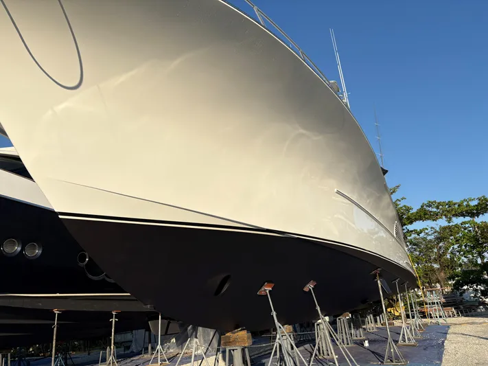  Yacht Photos Pics Buddy Davis 78 yacht from 2000 on stands, viewed from below against a clear sky.