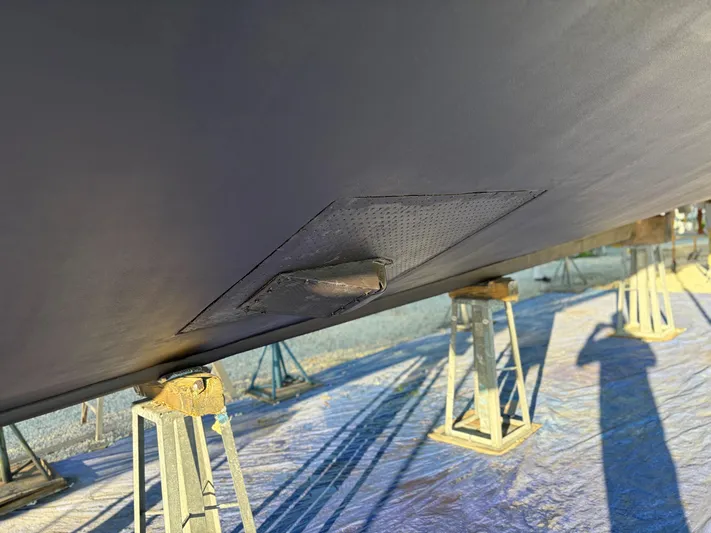  Yacht Photos Pics Bottom view of a 2000 Buddy Davis 78 boat on stands, showing hull detail.