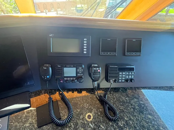  Yacht Photos Pics Control panel of a 2000 Buddy Davis 78 yacht with communication devices and screens.