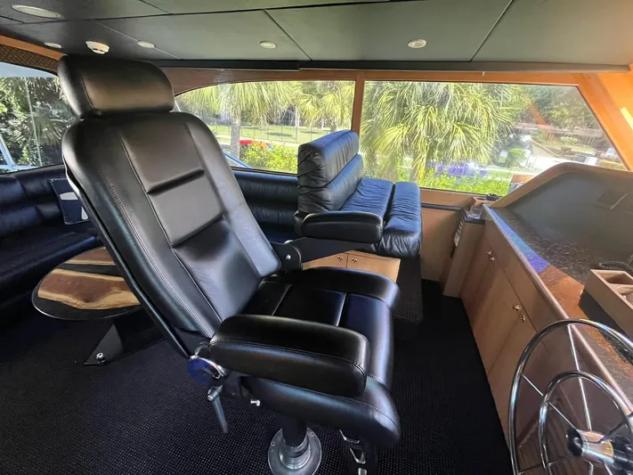  Yacht Photos Pics Luxurious interior of a 2000 Buddy Davis 78 yacht with leather seating and panoramic windows.