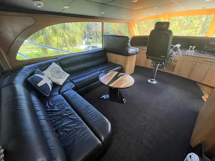  Yacht Photos Pics Luxurious interior of a 2000 Buddy Davis 78 yacht with leather seating and helm station.