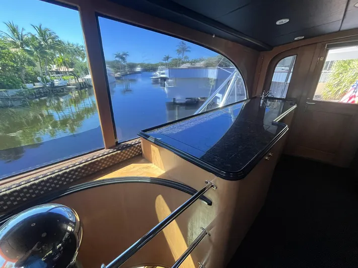  Yacht Photos Pics Luxurious interior of 2000 Buddy Davis 78 yacht with waterfront view.