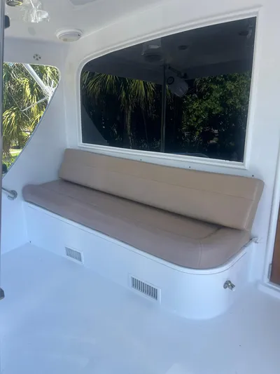  Yacht Photos Pics Interior seating area of a 2000 Buddy Davis 78 yacht with beige cushions.