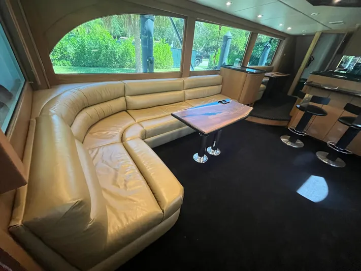  Yacht Photos Pics Luxurious interior of 2000 Buddy Davis 78 yacht with leather seating and modern bar area.