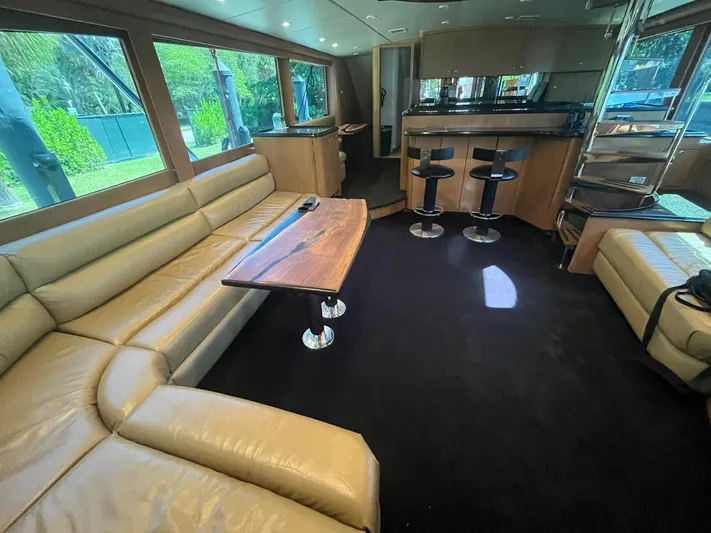 Yacht Photos Pics Luxurious interior of a 2000 Buddy Davis 78 yacht with leather seating and modern bar area.