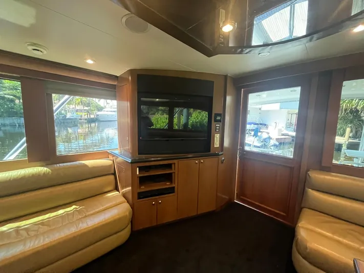  Yacht Photos Pics Luxurious interior of 2000 Buddy Davis 78 yacht with leather seating and large windows.