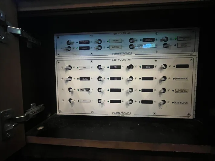  Yacht Photos Pics Electrical control panel inside a Buddy Davis 78 yacht, year 2000, featuring various switches and indicators.
