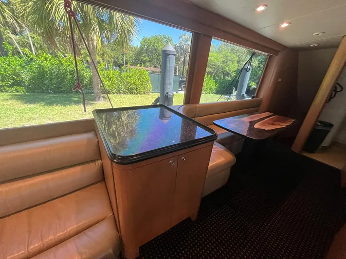  Yacht Photos Pics Interior of 2000 Buddy Davis 78 yacht with leather seating and glossy table.