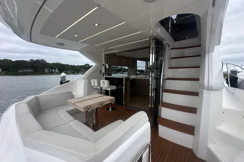  Yacht Photos Pics Luxurious 2018 Sunseeker Manhattan 52 yacht interior with seating, table, and stairs.