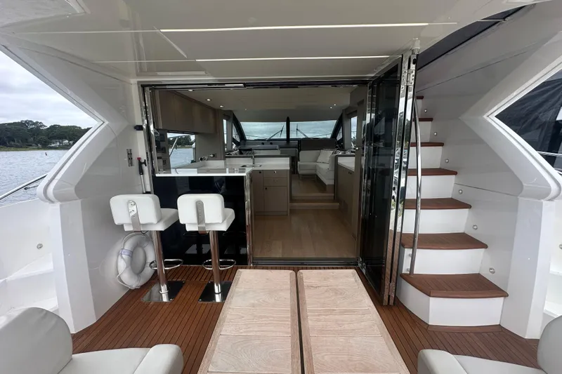  Yacht Photos Pics 2018 Sunseeker Manhattan 52 yacht interior with modern design and wooden flooring.