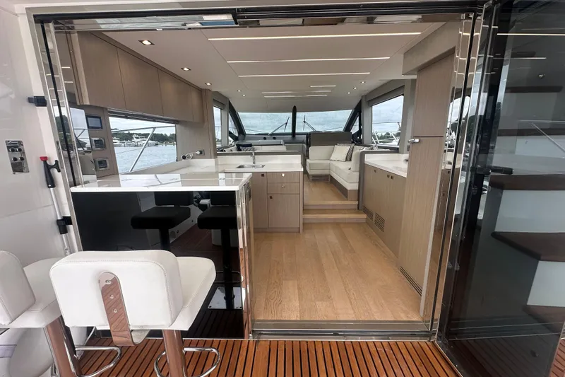  Yacht Photos Pics Luxurious interior of 2018 Sunseeker Manhattan 52 yacht with modern furnishings and open layout.