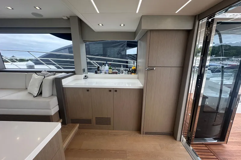  Yacht Photos Pics Luxurious interior of 2018 Sunseeker Manhattan 52 yacht with modern cabinetry and seating.