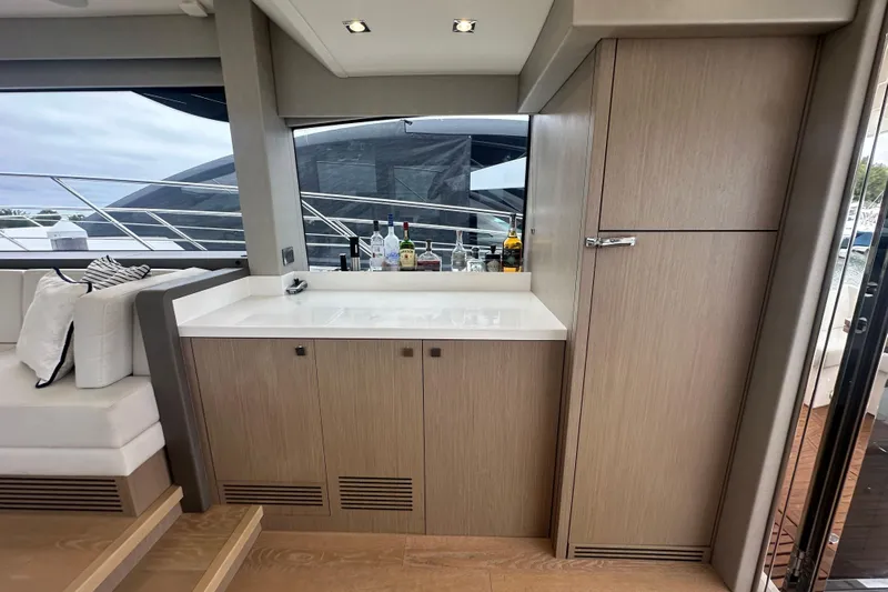  Yacht Photos Pics Luxurious interior of 2018 Sunseeker Manhattan 52 yacht with modern cabinetry and seating.