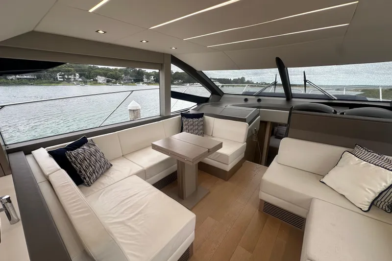  Yacht Photos Pics Luxurious interior of 2018 Sunseeker Manhattan 52 yacht with elegant seating and scenic views.