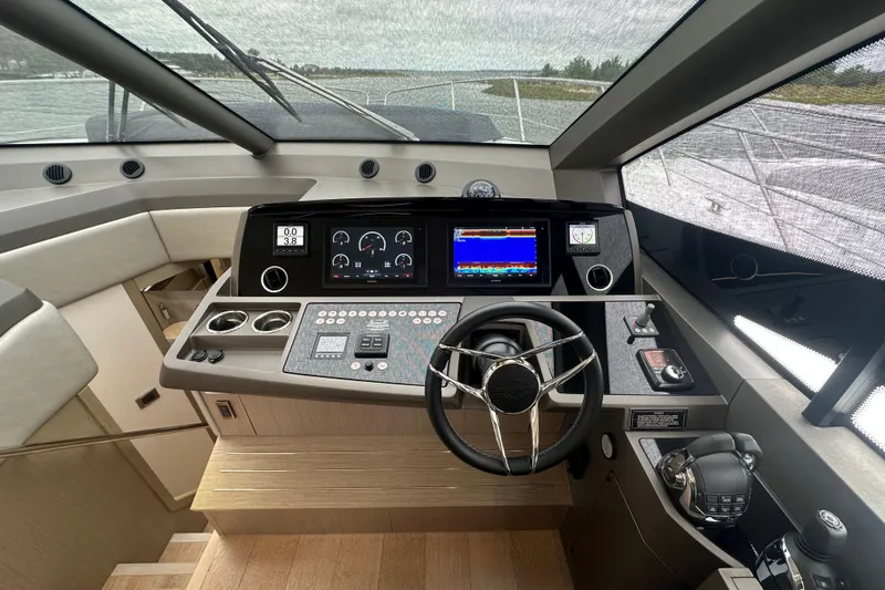  Yacht Photos Pics 2018 Sunseeker Manhattan 52 yacht helm with advanced navigation controls and sleek design.