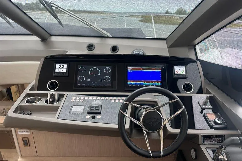  Yacht Photos Pics Helm of 2018 Sunseeker Manhattan 52 yacht with modern navigation controls.