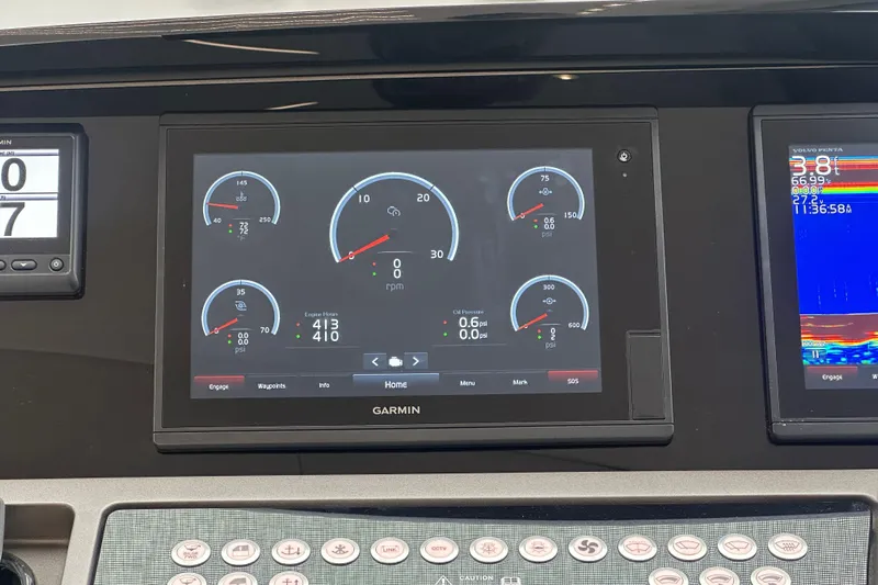  Yacht Photos Pics Garmin display on 2018 Sunseeker Manhattan 52 yacht dashboard, showing engine metrics and navigation data.
