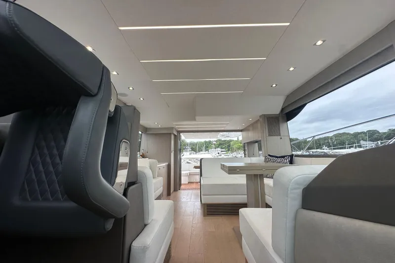  Yacht Photos Pics Luxurious interior of 2018 Sunseeker Manhattan 52 yacht, featuring modern seating and elegant design.