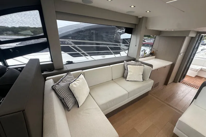  Yacht Photos Pics Luxurious interior of 2018 Sunseeker Manhattan 52 yacht with elegant seating and modern design.