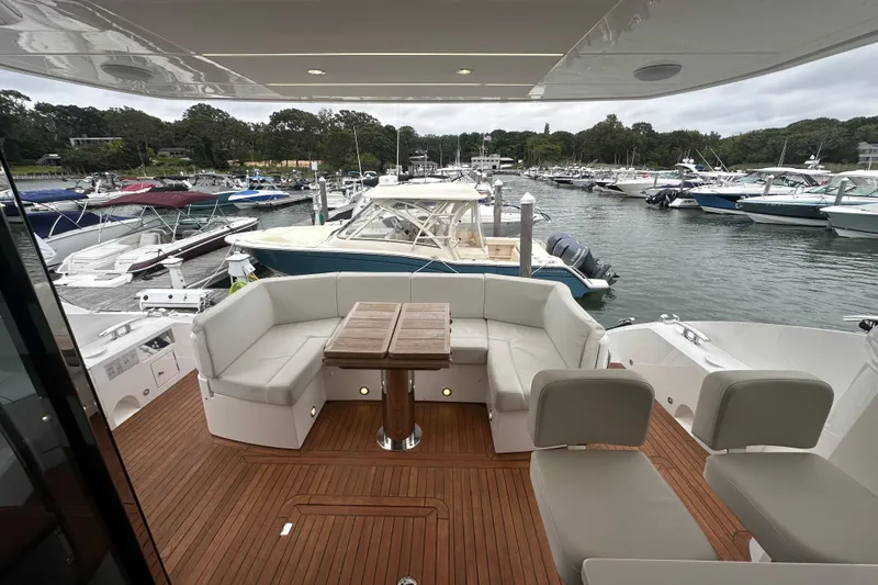  Yacht Photos Pics Luxurious 2018 Sunseeker Manhattan 52 yacht interior with elegant seating and marina view.