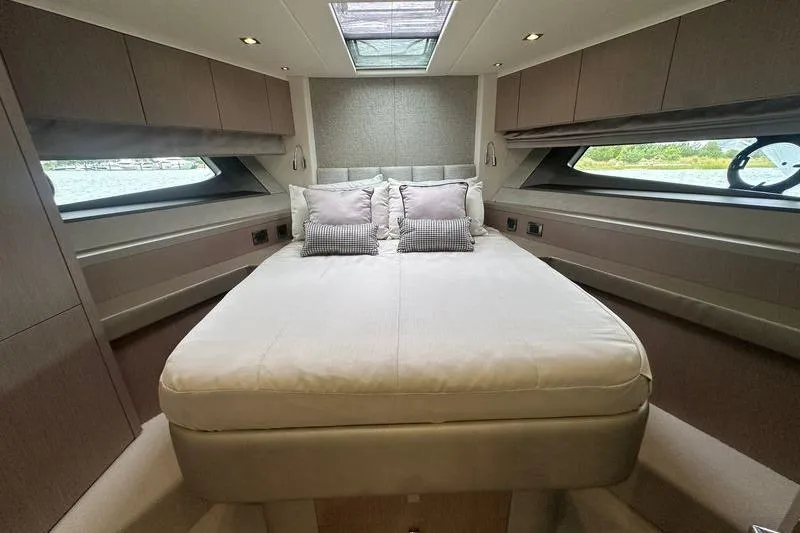  Yacht Photos Pics Luxurious bedroom interior of 2018 Sunseeker Manhattan 52 yacht with skylight and modern design.