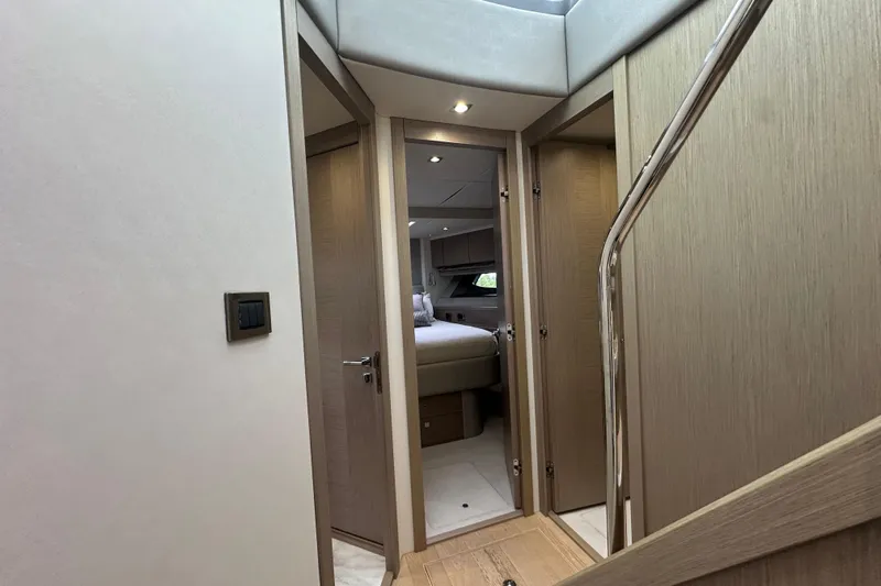  Yacht Photos Pics Interior view of 2018 Sunseeker Manhattan 52 yacht, featuring a cozy bedroom and modern design.