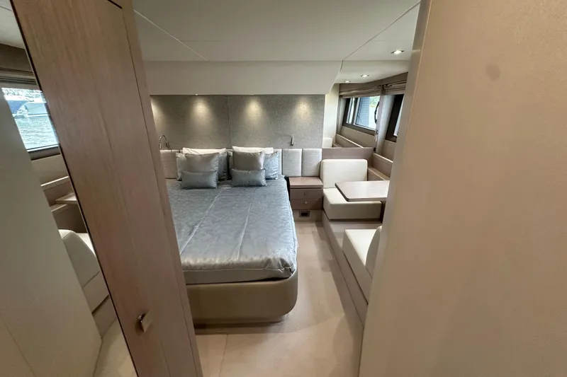  Yacht Photos Pics Luxurious interior of 2018 Sunseeker Manhattan 52 yacht with elegant bedroom and seating area.