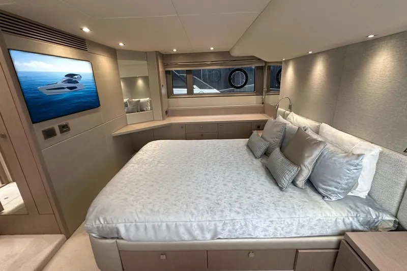  Yacht Photos Pics Luxurious bedroom interior of 2018 Sunseeker Manhattan 52 yacht with modern decor.
