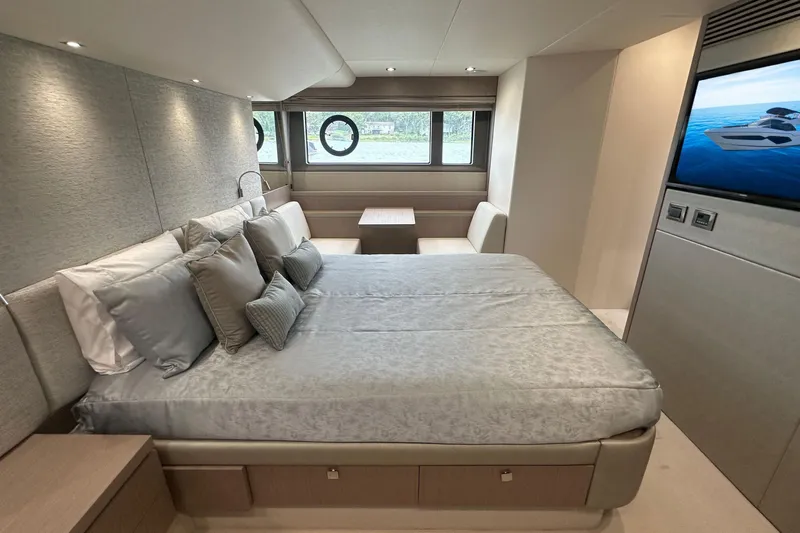  Yacht Photos Pics Luxurious bedroom interior of 2018 Sunseeker Manhattan 52 yacht with modern decor.