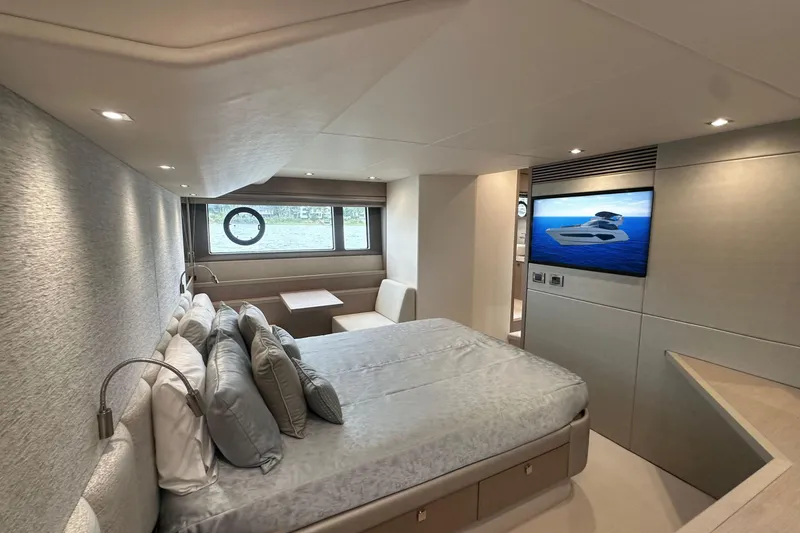  Yacht Photos Pics Luxurious interior of 2018 Sunseeker Manhattan 52 yacht with modern bedroom and TV.