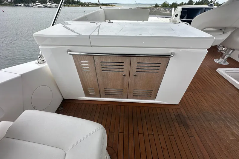 Yacht Photos Pics 2018 Sunseeker Manhattan 52 yacht interior with wooden flooring and sleek cabinetry.