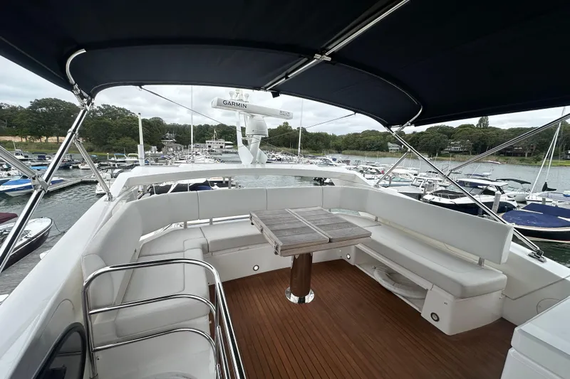  Yacht Photos Pics 2018 Sunseeker Manhattan 52 yacht with spacious deck and seating area.