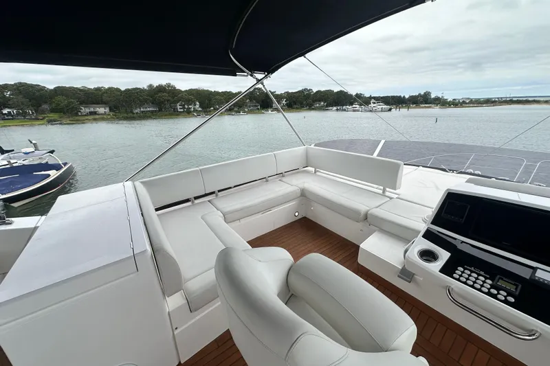  Yacht Photos Pics Luxurious 2018 Sunseeker Manhattan 52 yacht interior with white seating and control panel.