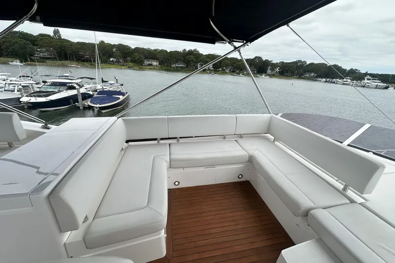  Yacht Photos Pics Luxurious 2018 Sunseeker Manhattan 52 yacht with spacious outdoor seating area.