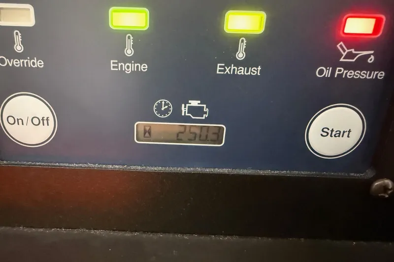  Yacht Photos Pics Control panel of a 2020 Pursuit OS 325 Offshore boat displaying engine status.