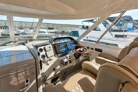 Lazy Gray Yacht Photos Pics 2008 Sea Ray 40 Motor Yacht cockpit with leather seating and modern navigation controls.