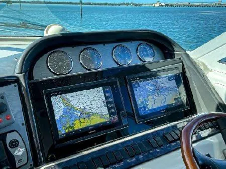 Lazy Gray Yacht Photos Pics Dashboard of a 2008 Sea Ray 40 Motor Yacht with navigation screens.