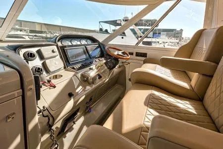 Lazy Gray Yacht Photos Pics 2008 Sea Ray 40 Motor Yacht cockpit with leather seating and modern controls.