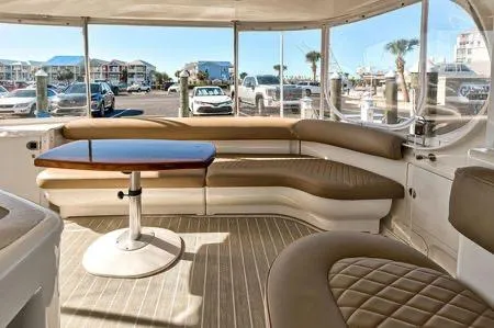 Lazy Gray Yacht Photos Pics 2008 Sea Ray 40 Motor Yacht interior with beige seating and wooden table.