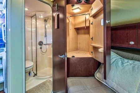 Lazy Gray Yacht Photos Pics 2008 Sea Ray 40 Motor Yacht interior with shower, wooden cabinetry, and cozy seating area.