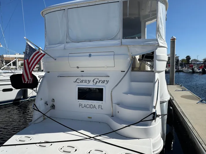 Lazy Gray Yacht Photos Pics 2008 Sea Ray 40 Motor Yacht docked in Placida, FL with American flag.