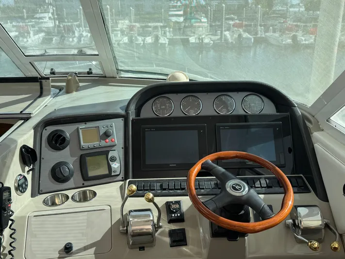 Lazy Gray Yacht Photos Pics 2008 Sea Ray 40 Motor Yacht helm with wooden steering wheel and navigation instruments.