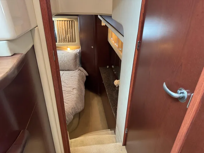 Lazy Gray Yacht Photos Pics Interior of 2008 Sea Ray 40 Motor Yacht, featuring cozy bedroom with wooden accents.