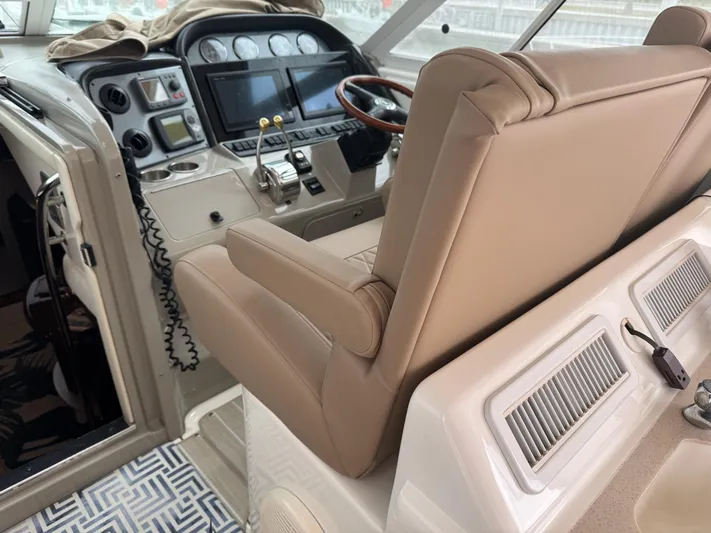 Lazy Gray Yacht Photos Pics 2008 Sea Ray 40 Motor Yacht helm with beige leather seating and modern controls.