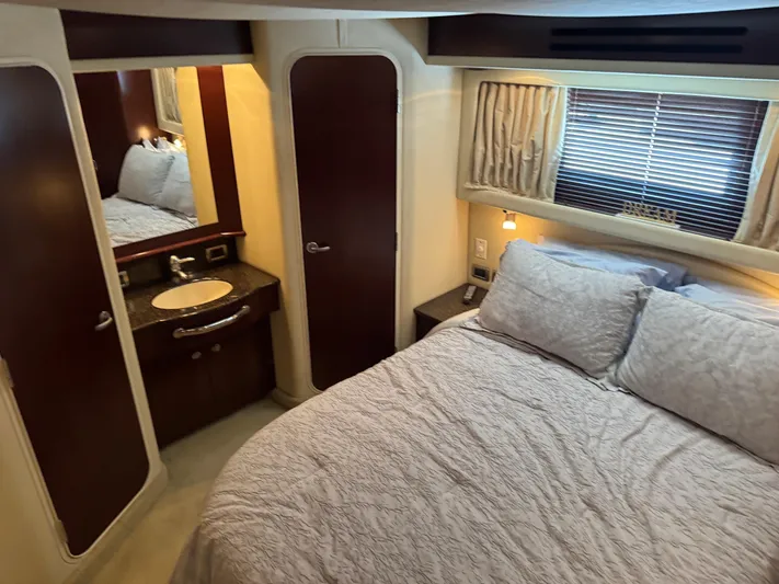 Lazy Gray Yacht Photos Pics Luxurious bedroom interior of 2008 Sea Ray 40 Motor Yacht with cozy bed and elegant decor.