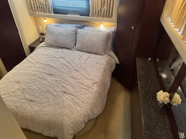 Lazy Gray Yacht Photos Pics Luxurious bedroom interior of 2008 Sea Ray 40 Motor Yacht with cozy bedding and elegant decor.