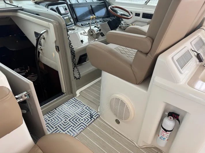 Lazy Gray Yacht Photos Pics 2008 Sea Ray 40 Motor Yacht helm with beige seating and modern controls.